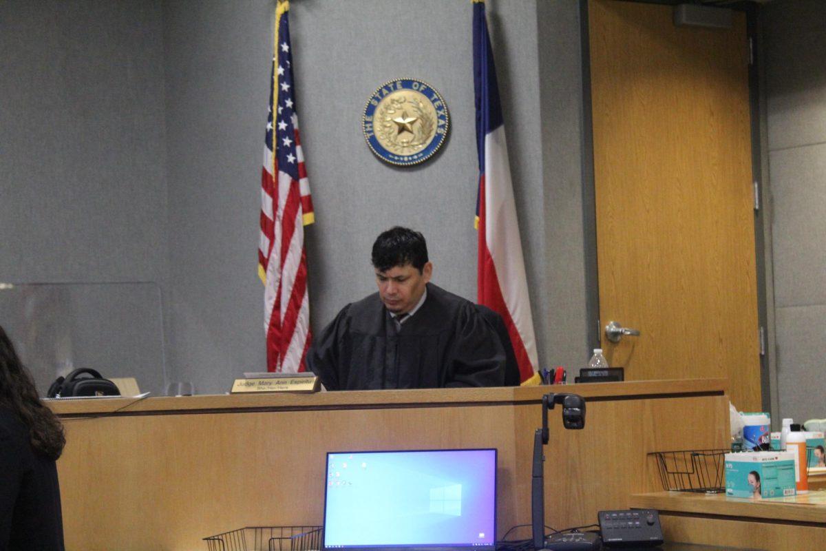 Teacher Johnny Galan presides as judge over the Mock Trial cases on Friday, March 22