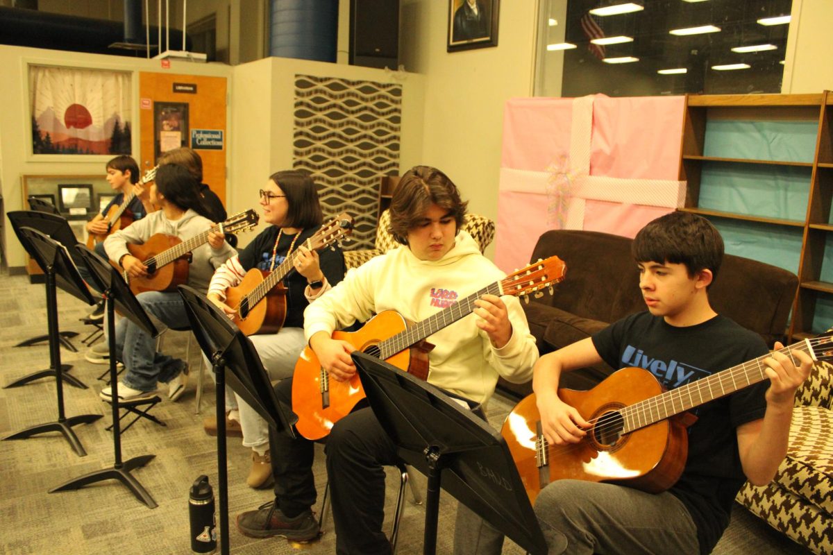 Guitar students perform at Evening of Wonder on December 6.