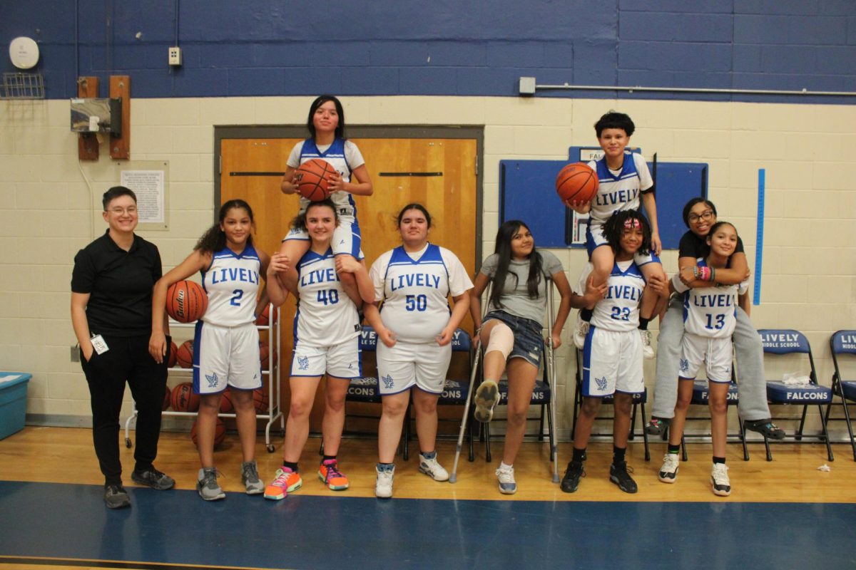 Coach Gabriel Dominguez and his 7th grade A team after their win against Lamar on December 19th.

From Left to Right: Acelee J, Gabriella R (on top), Frances D, Aiyanah V, Vivianna G, Ace T (on top), Tamareya W, Miracle M, and Evanna G