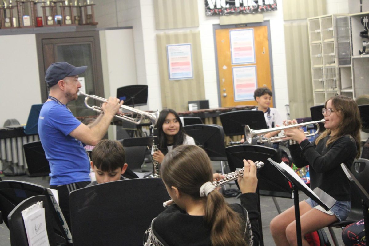 Mr. Gray giving a demonstration of the instrument in band class.