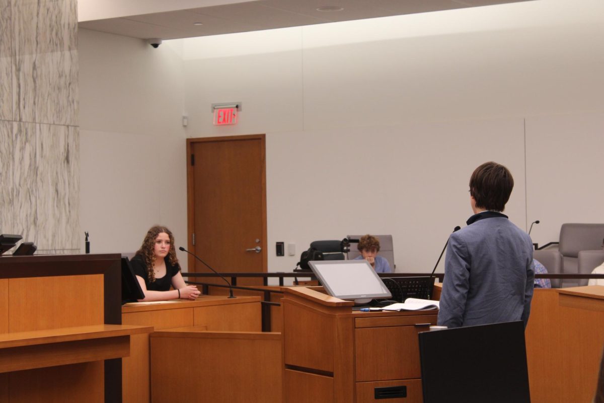 Charlie Murphy interviews a witness in the April 4 Mock Trial.